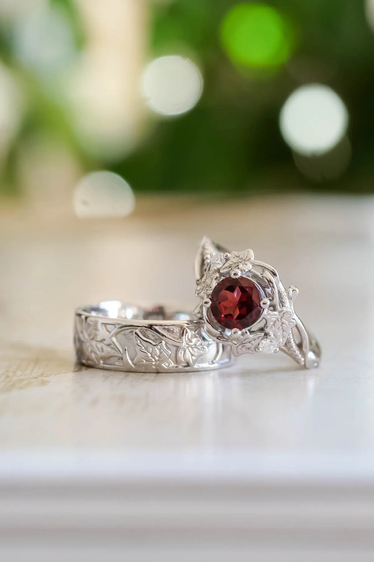 Wedding rings set for couples: gold ivy leaves band for him, gold ivy leaves ring with garnet for her